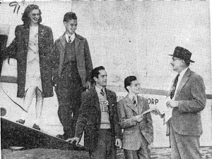 At the County Airport, County Executive Herbert C. Gerlach gives Hugh E. Hutchinson (second from left) a certificate of his rank as “General” in Westchester County for selling the most war bonds during the Seventh War Loan drive.