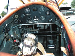 The bare bones cockpit of the Gypsy Flyers biplane offers few of the conveniences of modern aviation.