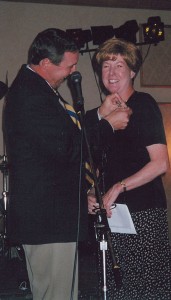 United Captain J.R. Russell (Denver chief pilot) pins Emily Howell Warner at her retirement party.