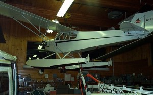 One of two 1938 Piper J3C-65s owned by Dr. Bird, this one (on Edo straight floats) made the first flights using "Smartplugs" catalytic ignition system instead of electrical engine ignition.