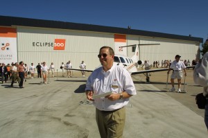Eclipse Founder and CEO Vern Raburn outside his Albuquerque plant with some of his employees, getting ready to test flight the Eclipse 500 jet.