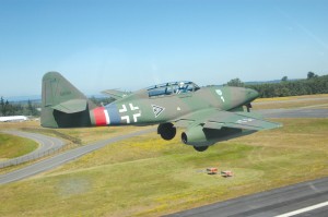 Wolfgang Czaia, flying a recreated, historic two-seat version of the famed Me 262, touches down at Paine Field after a scenic flight over Puget Sound.