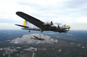 The “Liberty Belle” and “Glacier Girl” fly by Stone Mountain.