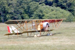 A 1914 Caudron G.III taxis for takeoff. Note the rotary engine spinning behind the propeller; the open lower cowl was designed to expel used castor oil downward away from the pilot.