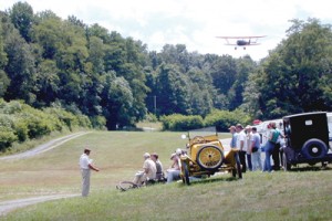 Old Rhinebeck’s 1929 New Standard D-25 biplane approaches the rolling grass runway for landing.