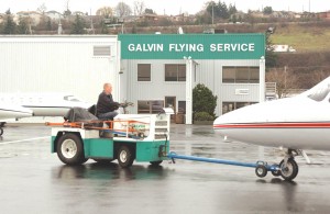Line Supervisor Jon Bickford tugs a plane on Galvin’s main passenger ramp.