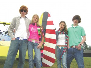 Posed near Auburn pilot Rich Aldrich’s 1940 Stearman Kadet, Dylan Jones, ‘Shelby Condon, Catherine Fagen and Malcolm George model colorful SkyBelts that are gaining popularity with both teens and pilots.