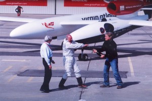 Sir Richard Branson, president and CEO of Virgin Atlantic Airways, sprays GlobalFlyer pilot Steve Fossett with champagne after his successful flight.