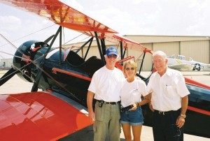 L to R: Prior to take-off, pilots J.D. Daniels and Michelle Bright pose with Ray Roberts, of Basic Capital Management, in front of the Spartan C-3.