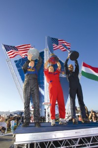 L to R: Americans Kirby Chambliss and Mike Mangold and Hungarian Peter Besenyei celebrate in the winners circle.