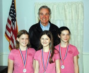 L to R: Aimee, Jill and Lauren of WASTYT (We Are Smarter Than You Think), the Haxtun Jr. High team that designed the first place spaceport model, pose with Burt Rutan at Wings Over the Rockies after the competition.