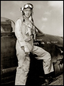 Naval aviator Bill Daniels stands on the wing of a Grumman F8F Bearcat in this post-World War II photograph.