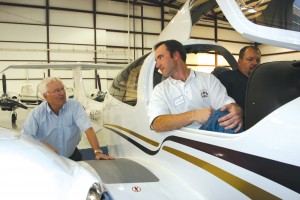 DA-42 position holder Blake Picquet (center), Ft. Worth, talks with Craig Smith, Diamond regional sales manager (left) as Mike Pace inspects the panel.