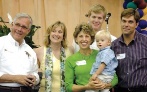 Three generations include Bob Showalter, the founder’s son and CEO; Jenny Showalter Harwood, customer service manager; Kim Showalter, president, who is holding grandson Evan Harwood; and Sandy Showalter, aircraft sales. Brent Harwood is behind his wife.