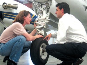 A certified flight instructor with JATO Aviation (right) takes a client through a step-up course designed to fully explain the aircraft’s mechanics.