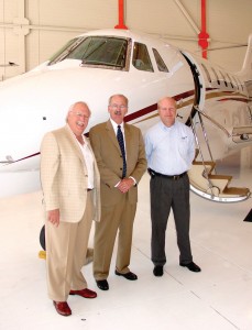 Clark Onstad, president of Precision Jet Management; Kerry McPherson; marketing manager for Mountain Aviation; and Rich Bjelkevig, president of Mountain Aviation, celebrate at Mountain’s June 14 open house.