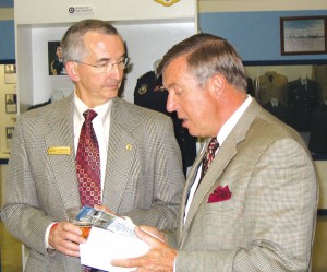 Terry Sullivan, president and CEO of Experience Colorado Springs at Pikes Peak, visits with ENT official Jim Moore at a media open house at the museum in late May.