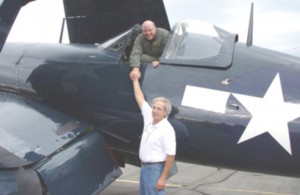 After this restored FG-1D Corsair’s first flight following 13 years of restoration, Gary Kohs of Royal Oak, Mich., warbird pilot and the plane’s owner, greets restorer John Lane.