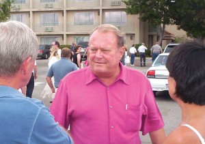 Jim Dunn (center), owner of the Airtel Plaza Hotel, chats with some guests as others head back into the Landing’s Restaurant after the flyovers.