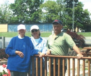 Leah Everett Fritsche (left), with two of her children, Linda and Bill. Mrs. Fritsche has two other daughters, neither of whom is involved in aviation.