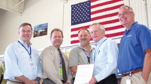 L to R: Rick Adam celebrates the A500’s production certificate with Ron May (FAA Denver aircraft certification office manager), Kurt Krumlauf (production certification board chair), Darrel Watson (Adam VP, quality assurance) and Joe Walker (president).