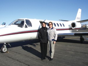 PPLI Captain Erin Recke (left) was thrilled to meet her senior navigator, Lucy Young, in person. Recke is a regional airline pilot. Young, a former Navy pilot, flies for US Airways.