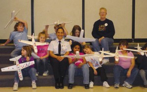 Becky Roman-Amador, a captain in the PPLI program and a regional airline first officer, talked to a Girl Scout troop as part of her leadership activities.