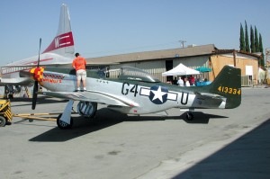 A museum volunteer readies this P-51 Mustang for flight.