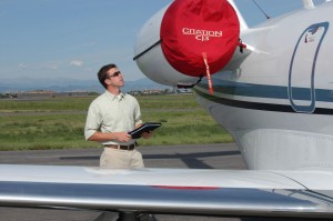 Morgan Cumley, co-owner of Immaculate Flight, performs an inspection on a Cessna Citation CJ-3 after it’s been detailed by his company.