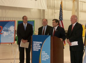 Congressman Steven Rothman describes the TEB Industry Working Group. Behind him are co-chairs (L to R) Joe Fazzio, GM of Atlantic Aviation; Bill DeCota, Port Authority aviation director; and James Coyne, president of NATA.