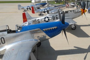 Four P-51 Mustangs sit on the ramp during the kickoff reception for the 2007 Gathering of Mustangs and Legends. The event expects to host more than 100 of these classic WWII aircraft, along with more than 50 living legends who made the Mustang famous.