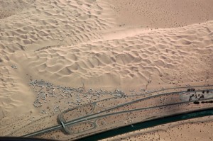 Off-road vehicle encampments line Interstate 8 through California’s Imperial Dunes.
