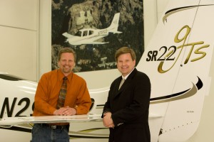 Dale (left) and Alan Klapmeier, in front of Cirrus aircraft parked outside the company’s plant in Duluth, Minn., co-founded Cirrus Design Corporation.