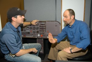 Sascha Protzko (right) and instructor Brian Doebele review advanced procedures in front of a flow trainer.