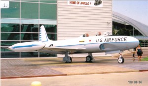 A Lockheed T-33, a two-seated trainer variant of the P-80 Shooting Star, guards the entrance to the Frontiers of Flight Museum.