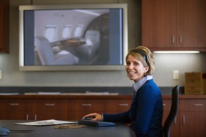 Elliott Aviation designer Meghan Welch works with customers to design new cabin interiors. The computer can depict the outcome, so customers easily see how the fabrics, colors and textures will work together.
