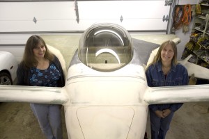 Chrissi Busch (left) and Randi Kelcher pose next to the new strakes they created for their Cozy Mark IV.