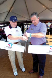 Tom Poberezny and Cessna CEO Jack Pelton cut the ribbon to introduce the new C-162 SkyCatcher. The release of this light sport aircraft promises another chapter in Cessna’s history of teaching the world to fly.