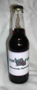 The new Vin Fiz bottle label features a female pilot believed to be Harriet Quimby.