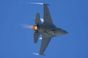 Afterburners ablaze, a USAF F-16 Falcon thrills the crowd with a tight radius turn.