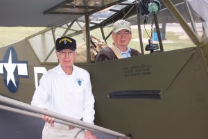 Jim Stegall pauses for a photograph before hopping into the front cockpit of the L-4 Cub. Hugh O’Donnell is in the back.