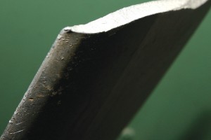 This propeller lost four inches from the tip when a stress fracture grew from a nick in the leading edge.