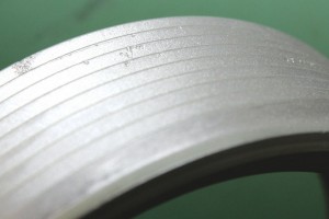 Corrosion caused the small pits along the threads of this propeller-retaining ring. This highly stressed part is subject to failure when corrosion develops.