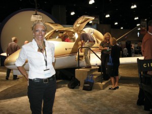 Patty Wagstaff, in front of Cirrus’ personal jet, signed autographed photos in the Cirrus booth.
