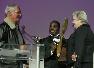 Dick Rutan (left) and Barrington Irving present Peggy Fossett (right) with the Spreading Wings award.