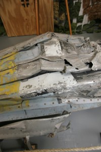 Visitors can still make out faint blue paint and an Iron Cross on the underside of this crumpled Messerschmitt BF-109 wing.