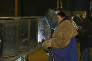 Welders attach the “wavy-web” to the bottom flange. Every EagleSpan truss is custom made for each installation.