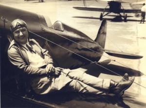 Pancho Barnes rests on the wing of her Travel Air Model R, which she later loaned to stunt pilot Paul Mantz for use in the movies.