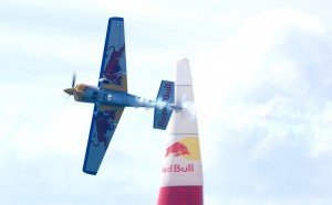 American pilot Kirby Chambliss, of Team Red Bull, demonstrates knife-edge flying past an air gate on the San Diego racecourse.