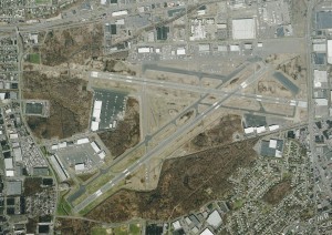 The small gray patch on the end of Runway 24, towards the right in the middle of the photo, is the EMAS installed since a 2005 accident. Runway 1, on the lower left, is about to have one installed, since two local roads come together at right angles.